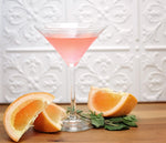 A Ruby Red Fizz Cocktail featuring HDC Ruby Red Grapefruit Vodka served up in a martini glass.