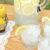 A pitcher Boozy Lemonade and full cocktail glass using your favorite HDC Flavored Vodka.