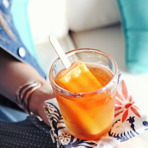 Perfect for a hot day, this Brown Sugar Bourbon Popsicle Cocktail has a popsicle placed in the drink.