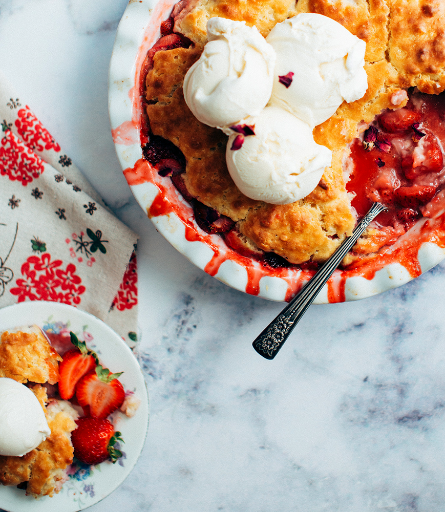 A berry cobbler made from BSB - Brown Sugar Bourbon and topping with scoops of vanilla ice cream.