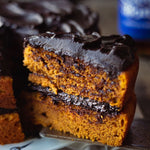Pumpkin & Cocoa Bomb Chocolate Whiskey Layer Cake with Glossy Fudge Frosting
