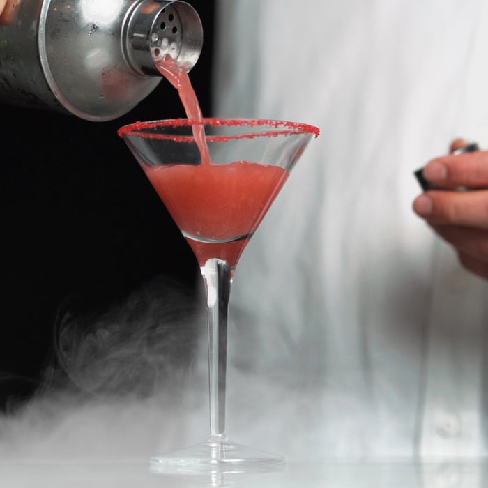 This Cosmo features HDC Blood Orange Vodka served in a martini glass with an orange peel garnish.