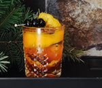 A true old fashioned made with HDC Dual Barrel Old Fashioned Ready Rye and garnished with orange peels and cherries.