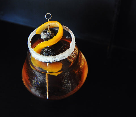 A sugar-rimmed cocktail glass with a drink that uses HDC Dual Barrel Old Fashioned Ready Rye and HDC Citrus Vodka.