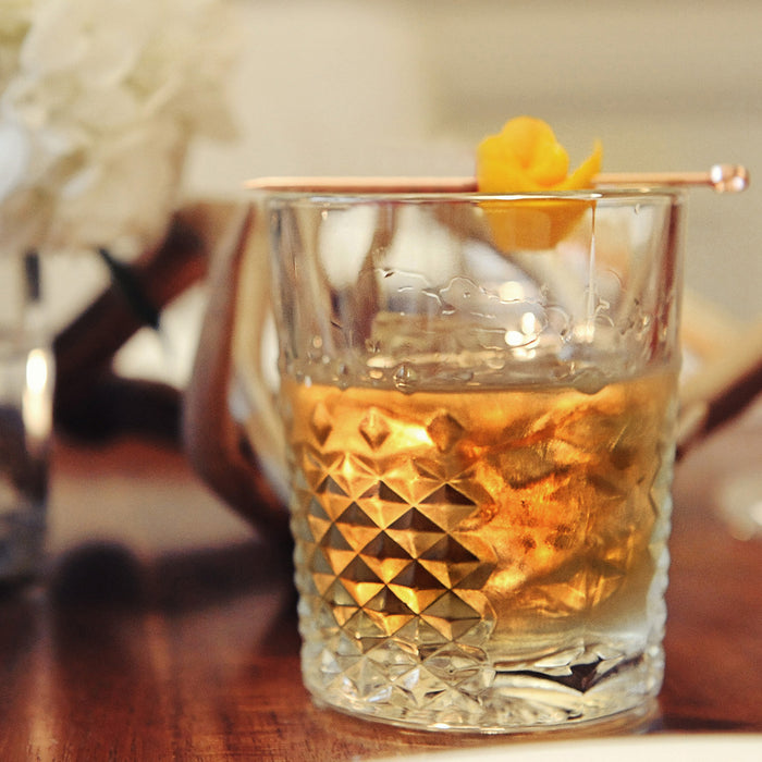 This cocktail in a tumbler of ice features HDC Elk Rider Bourbon.