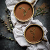 Two mugs of Bourbon & Thyme Sweet Is The Spice Hot Chocolate featuring BSB 103 - Brown Sugar Bourbon 103