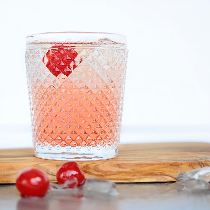 A glass of Dirty Shirley Cocktail featuring HDC Elk Rider Vodka and topped with cherries.