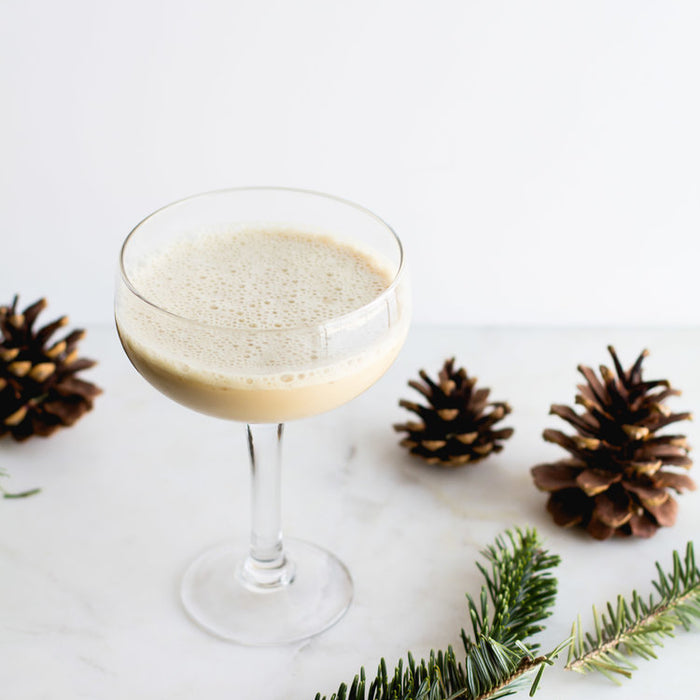 The Eggnog Latte Cocktail (using HDC Elk Rider Vodka) and some decorative pine cones.