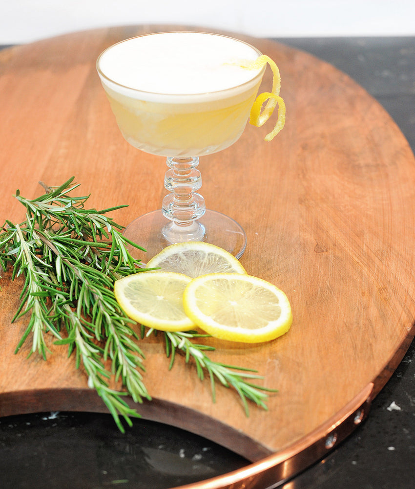 A gin cocktail using HDC Elk Rider Gin poured over ice and garnished with rosemary.