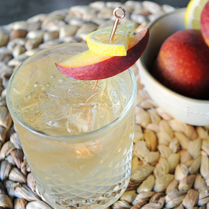 In a highball glass, this cocktail features HDC Elk Rider Bourbon and HDC Peach Vodka together. Talk about the best of both worlds! Of course, peach slices complete the drink.