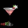 A sugar-rimmed martini glass with a HDC Elk Rider Vodka-based cocktail with fresh raspberries on a stir stick.