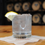 The Heritage Distilling Co. branded rocks glass with an HDC Lavender Vodka cocktail.