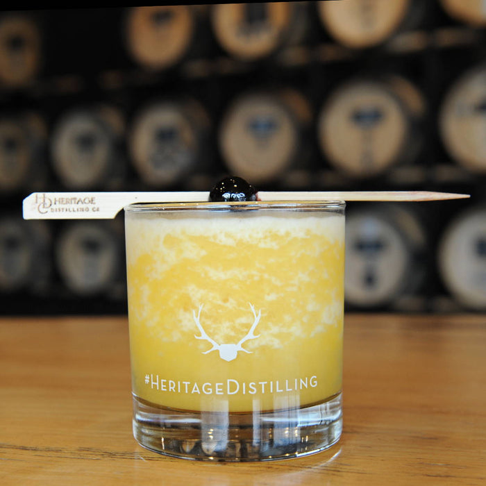 This slush drink is made with HDC Vanilla Vodka and garnished with a cherry.