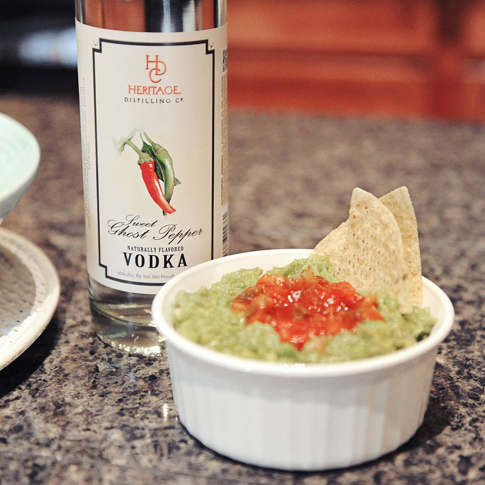 This delicious guac is made with HDC Sweet Ghost Pepper Vodka.