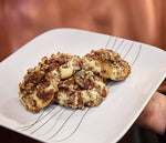 A square plate full of caramel pecan thumbprint cookies using BSB - Brown Sugar Bourbon. 