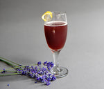 In a daisy goblet, this red cocktail is a blend of HDC Lavender Vodka and Elk Rider Gin to create the perfect cocktail.