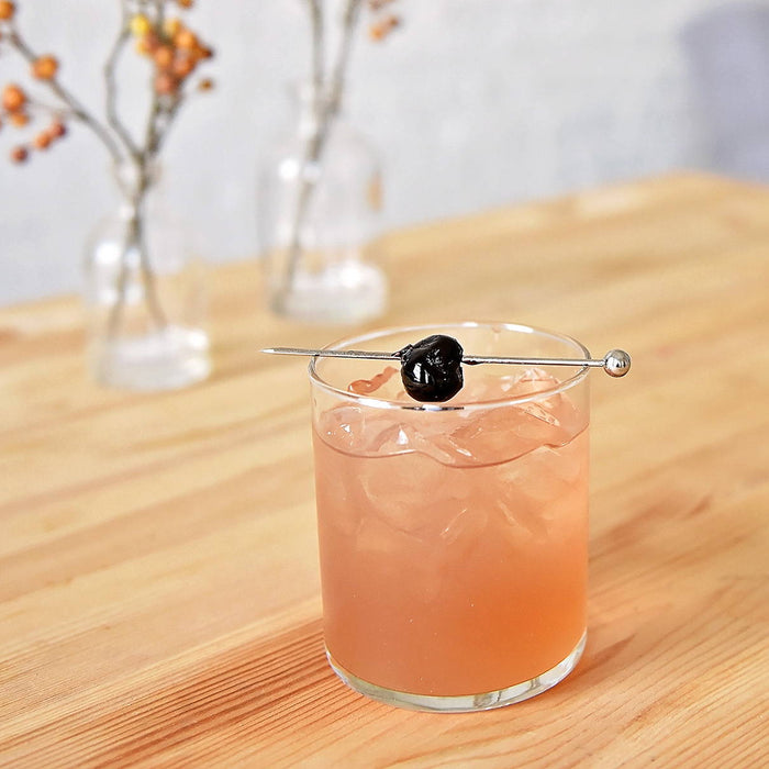 This BSB 103 cocktail is served over ice and garnished with a Luxardo cherry.