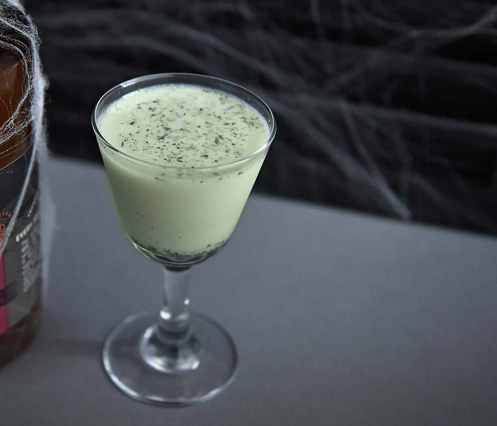This Halloween-themed cocktail is made with BSB 103 and garnished with grated nutmeg.
