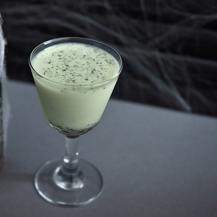 This Halloween-themed cocktail is made with BSB 103 and garnished with grated nutmeg.