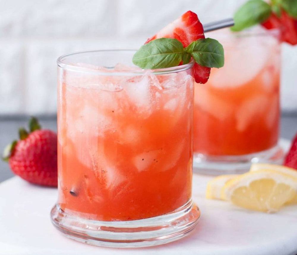 Two BSB Brown Sugar Bourbon and strawberry cocktails.