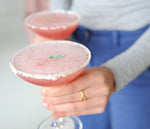 Two full glasses of the Huckleberry Vodkarita. This drink uses HDC Huckleberry Vodka and Dimitri's Margarita Mix to create a light cocktail.