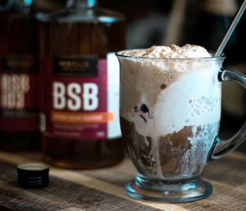 An overflowing mug filled with the BSB - Bourbon Sugar Bourbon Float.