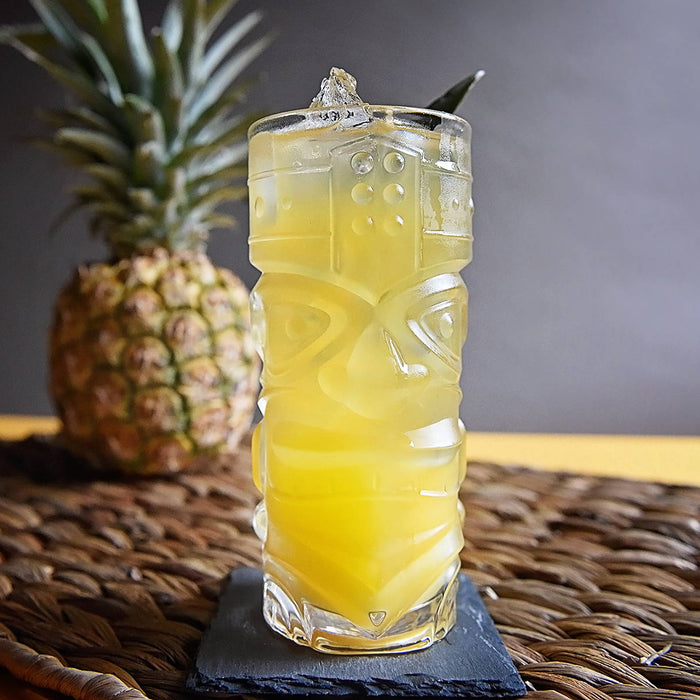 A bright yellow rum-based cocktail with pineapple chunk garnishes. Best made with HDC Commander's Spiced Rum.
