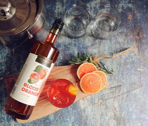 
                  
                    A 750ml bottle of HDC Blood Orange Vodka and a Rhymes with Orange Cocktail.
                  
                