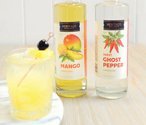 
                  
                    A 750ml bottle of Mango Vodka and a 750ml bottle of Sweet Ghost Pepper with a Sweet Heat Cocktail that uses both spirits in it.
                  
                